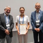 EMS2022 Awards ceremony: Alice Portal, winner of the Innovative Presentation Award 2021, with Vice President Dominique Marbouty (left) and President Bert Holtslag (right); (photo: Geza Aschoff, Germany)