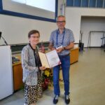 Bert Holtslag, member of the selection committee for the Sergej Zilitinkevich Award, presenting the certificate to the awardee Sue Grimmond (photo by Gert-Jan Steeneveld)